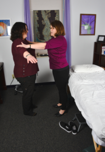 two women showing physical therapy exercises